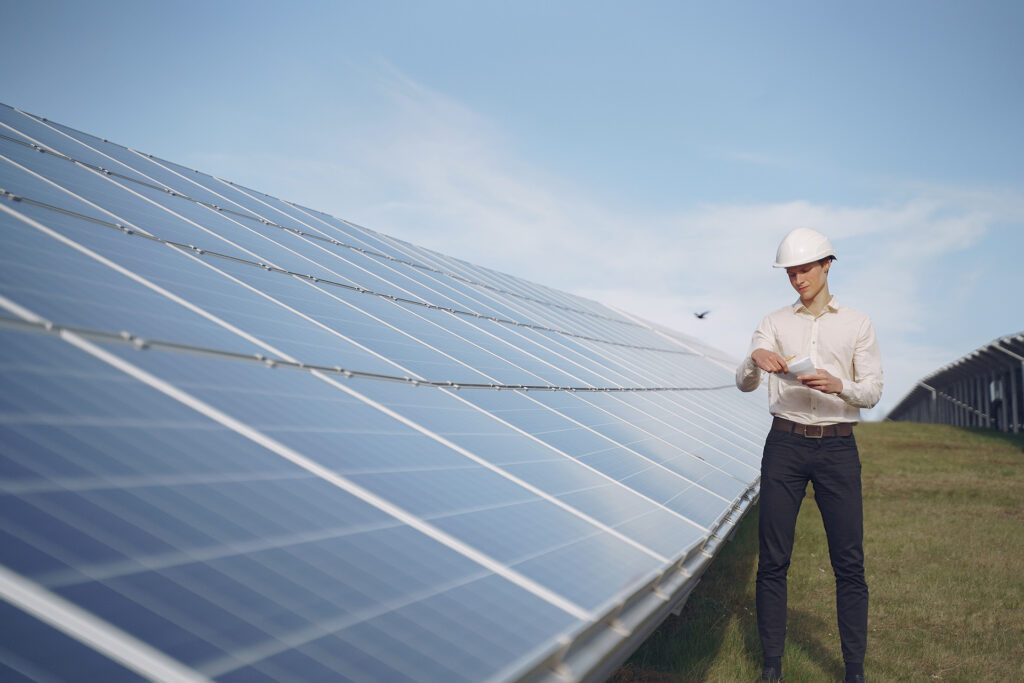 businessman in a white helmet near solar battery 2021 08 29 00 35 46 utca - - Level Up Solar